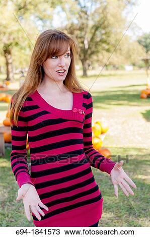 30 Year old redheaded woman smiling and gesturing with her hands View Large Photo Image Stock Image - 30 Year old redheaded woman smiling and gesturing with her hands. Fotosearch