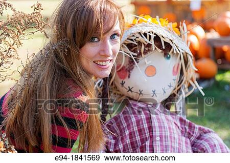 30 Year old redheaded woman with a scare crow View Large Photo Image Stock Photo - 30 Year old redheaded woman with a scare crow. Fotosearch
