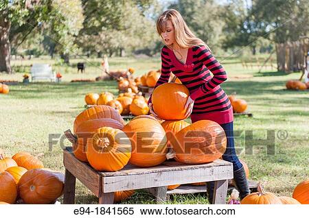30 Year old redheaded woman with pumpkins in autumn View Large Photo Image Stock Photography - 30 Year old redheaded woman with pumpkins in autumn. Fotosearch