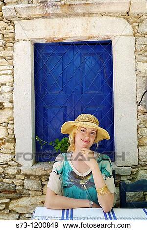 Stock Photo - 30 year old woman in a Naxos restaurant, Cyclades Islands, Greece, Europe. Fotosearch