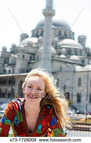 Stock Photo - 30 year old woman in front of Blue Mosque, Istanbul. Turkey. Fotosearch