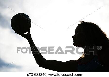 Stock Image - 30 year old woman with ball.. Fotosearch