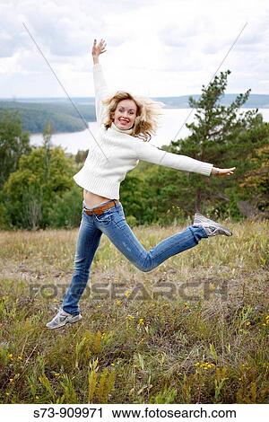 30 years old woman jumping in Maladieski Kurdan Natural Park in Toglyatty, Samara Region, Russian Federation, Russia View Large Photo Image Stock Image - 30 years old woman jumping in Maladieski Kurdan Natural Park in Toglyatty, Samara Region, Russian Federation, Russia. Fotosearch