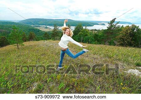 30 years old woman jumping in Molodeskiy Kurgan National Park in Toglyatty, Samara Region, Russian Federation, Russia View Large Photo Image Stock Image - 30 years old woman jumping in Molodeskiy Kurgan National Park in Toglyatty, Samara Region, Russian Federation, Russia. Fotosearch
