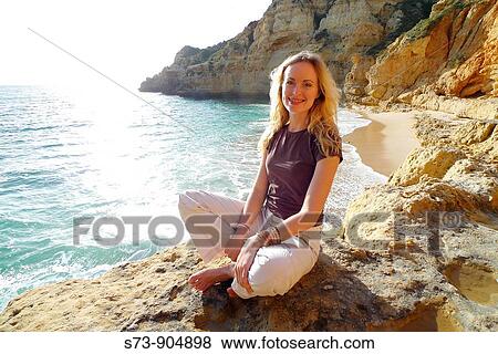 Stock Photo - 30 years old woman on Paraiso beach, Carvoeiro, Algarve, Portugal, Europe. Fotosearch