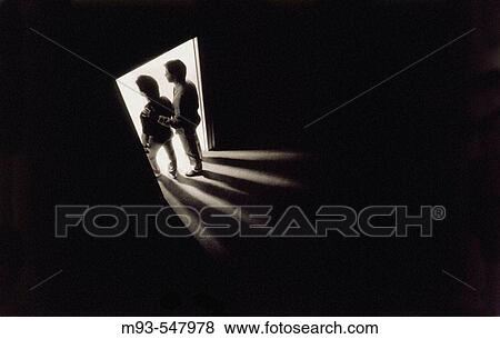 30s 40s man and male adolescent silhouetted in doorway. Bright light in room they are entering; darkness in room they are leaving. View Large Photo Image Stock Photo - 30s 40s man and male adolescent silhouetted in doorway. Bright light in room they are entering; darkness in room they are leaving.. Fotosearch