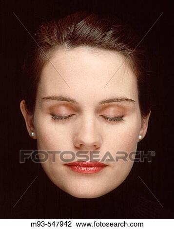 Stock Image - 30s caucasian woman with eyes closed.. Fotosearch