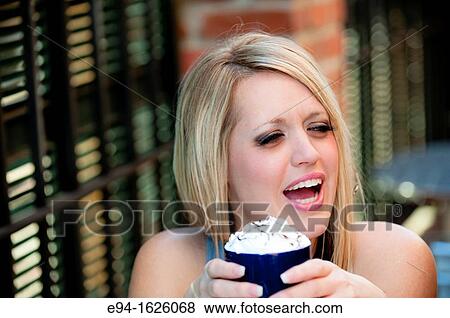 31 year old blond woman holding a coffee mug in a cafe View Large Photo Image Stock Photo - 31 year old blond woman holding a coffee mug in a cafe. Fotosearch