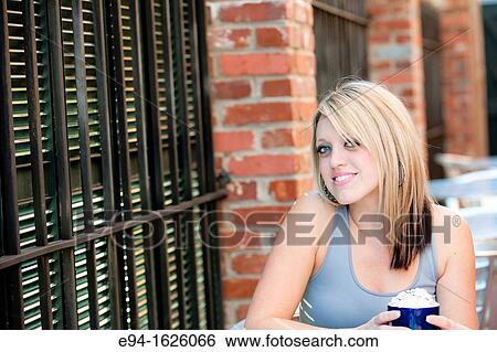 31 year old blond woman holding a coffee mug in a cafe View Large Photo Image Stock Photograph - 31 year old blond woman holding a coffee mug in a cafe. Fotosearch