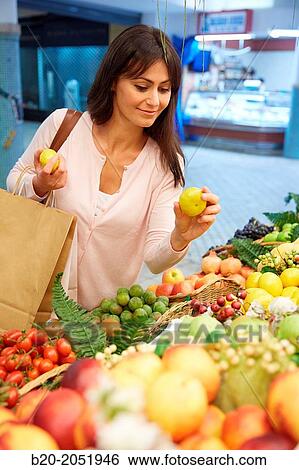 35 year old woman buying fruit. Shopping at the Bretxa Market. Donostia. San Sebastian. Gipuzkoa. Basque Country. Spain. View Large Photo Image Stock Photograph - 35 year old woman buying fruit. Shopping at the Bretxa Market. Donostia. San Sebastian. Gipuzkoa. Basque Country. Spain.. Fotosearch