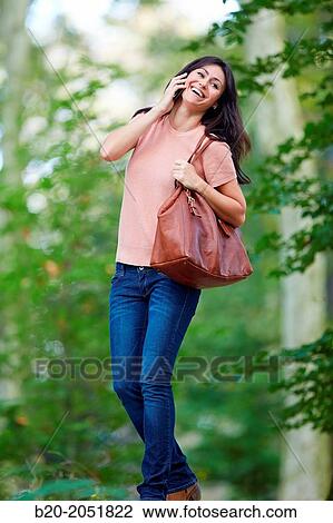 35 year old woman in park talking with smartphone. Donostia. San Sebastian. Gipuzkoa. Basque Country- Spain. View Large Photo Image Stock Image - 35 year old woman in park talking with smartphone. Donostia. San Sebastian. Gipuzkoa. Basque Country- Spain.. Fotosearch