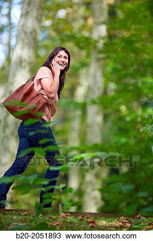 35 year old woman in park talking with smartphone. Donostia. San Sebastian. Gipuzkoa. Basque Country- Spain. View Large Photo Image Stock Image - 35 year old woman in park talking with smartphone. Donostia. San Sebastian. Gipuzkoa. Basque Country- Spain.. Fotosearch
