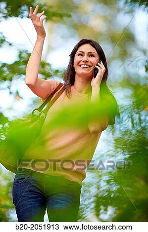 35 year old woman in park talking with smartphone. Donostia. San Sebastian. Gipuzkoa. Basque Country- Spain. View Large Photo Image Stock Image - 35 year old woman in park talking with smartphone. Donostia. San Sebastian. Gipuzkoa. Basque Country- Spain.. Fotosearch