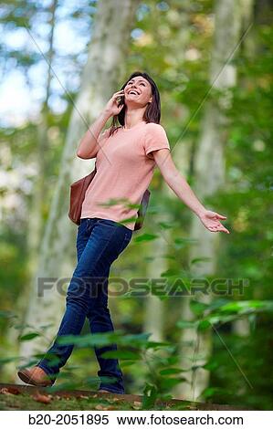 35 year old woman in park talking with smartphone. Donostia. San Sebastian. Gipuzkoa. Basque Country- Spain. View Large Photo Image Stock Photography - 35 year old woman in park talking with smartphone. Donostia. San Sebastian. Gipuzkoa. Basque Country- Spain.. Fotosearch