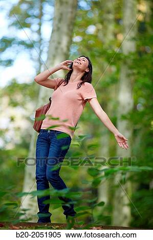 35 year old woman in park talking with smartphone. Donostia. San Sebastian. Gipuzkoa. Basque Country- Spain. View Large Photo Image Stock Photography - 35 year old woman in park talking with smartphone. Donostia. San Sebastian. Gipuzkoa. Basque Country- Spain.. Fotosearch