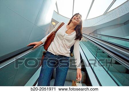 35 year old woman on escalators. Shopping at the Bretxa Market. Donostia. San Sebastian. Gipuzkoa. Basque Country. Spain. View Large Photo Image Stock Image - 35 year old woman on escalators. Shopping at the Bretxa Market. Donostia. San Sebastian. Gipuzkoa. Basque Country. Spain.. Fotosearch