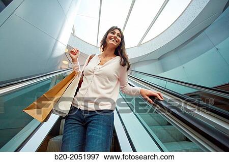 35 year old woman on escalators. Shopping at the Bretxa Market. Donostia. San Sebastian. Gipuzkoa. Basque Country. Spain. View Large Photo Image Stock Photo - 35 year old woman on escalators. Shopping at the Bretxa Market. Donostia. San Sebastian. Gipuzkoa. Basque Country. Spain.. Fotosearch