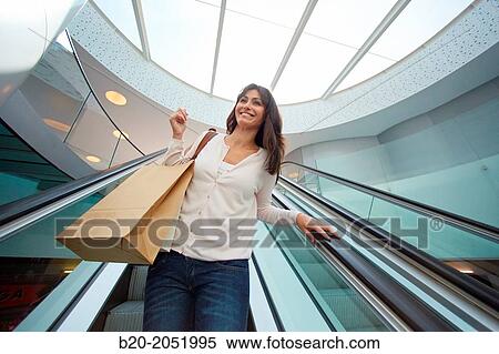 35 year old woman on escalators. Shopping at the Bretxa Market. Donostia. San Sebastian. Gipuzkoa. Basque Country. Spain. View Large Photo Image Stock Photography - 35 year old woman on escalators. Shopping at the Bretxa Market. Donostia. San Sebastian. Gipuzkoa. Basque Country. Spain.. Fotosearch
