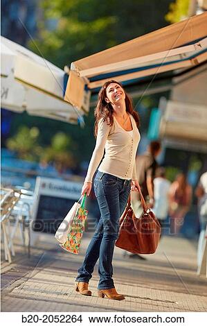 35 year old woman shopping on the street. Donostia. San Sebastian. Gipuzkoa. Basque Country. Spain. View Large Photo Image Picture - 35 year old woman shopping on the street. Donostia. San Sebastian. Gipuzkoa. Basque Country. Spain.. Fotosearch