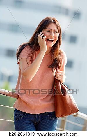 35 year old woman talking with smartphone in town. Donostia. San Sebastian. Gipuzkoa. Basque Country, Spain. View Large Photo Image Stock Photo - 35 year old woman talking with smartphone in town. Donostia. San Sebastian. Gipuzkoa. Basque Country, Spain.. Fotosearch