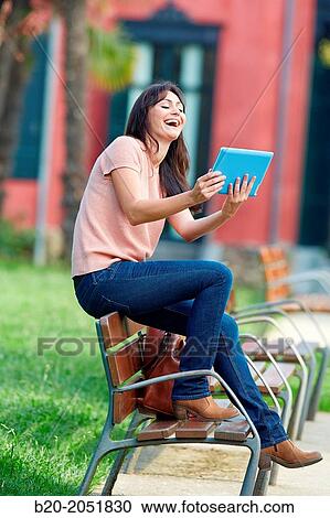 35 year old woman with tablet in a park. Donostia. San Sebastian. Gipuzkoa. Basque Country, Spain. View Large Photo Image Stock Image - 35 year old woman with tablet in a park. Donostia. San Sebastian. Gipuzkoa. Basque Country, Spain.. Fotosearch