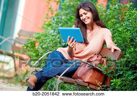 35 year old woman with tablet in a park. Donostia. San Sebastian. Gipuzkoa. Basque Country, Spain. View Large Photo Image Stock Image - 35 year old woman with tablet in a park. Donostia. San Sebastian. Gipuzkoa. Basque Country, Spain.. Fotosearch