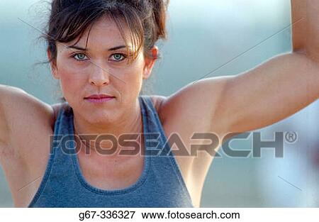 35 years old woman flexes muscles on the beach. Santa Monica. California. USA. View Large Photo Image Stock Photo - 35 years old woman flexes muscles on the beach. Santa Monica. California. USA.. Fotosearch