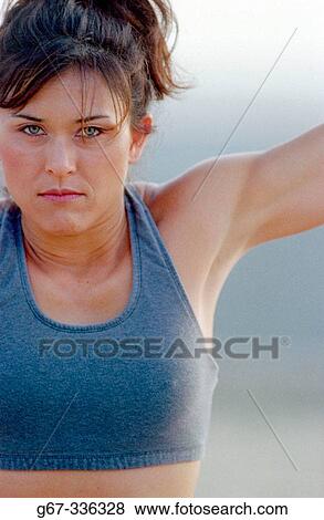 35 years old woman flexes muscles on the beach. Santa Monica. California. USA. View Large Photo Image Stock Photo - 35 years old woman flexes muscles on the beach. Santa Monica. California. USA.. Fotosearch