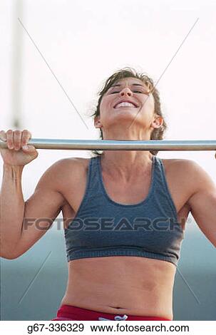 35 years old woman flexes muscles on the beach. Santa Monica. California. USA. View Large Photo Image Stock Photo - 35 years old woman flexes muscles on the beach. Santa Monica. California. USA.. Fotosearch