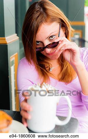 38 year old redhead woman at an outdoor cafe witha coffee cup making a face at the camera View Large Photo Image Stock Photo - 38 year old redhead woman at an outdoor cafe witha coffee cup making a face at the camera. Fotosearch