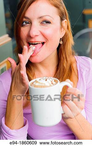 38 year old redhead woman at an outdoor cafe witha coffee cup making a face at the camera View Large Photo Image Stock Photo - 38 year old redhead woman at an outdoor cafe witha coffee cup making a face at the camera. Fotosearch