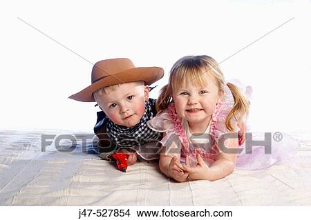 3and 4 year old brother and sister lying on the floor smiling View Large Photo Image Picture - 3and 4 year old brother and sister lying on the floor smiling. Fotosearch