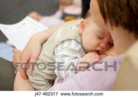 4 week old baby asleep on her mothers chest View Large Photo Image Stock Photo - 4 week old baby asleep on her mothers chest. Fotosearch