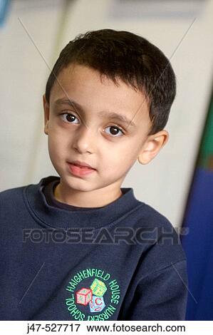 4 year old boy from Pakistan smiling into camera at nursery View Large Photo Image Stock Photo - 4 year old boy from Pakistan smiling into camera at nursery. Fotosearch