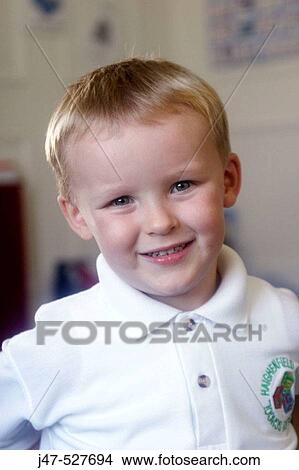 4 year old boy smiling into camera at nursery View Large Photo Image Picture - 4 year old boy smiling into camera at nursery. Fotosearch