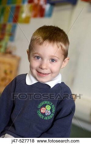 4 year old boy smiling into camera at nursery View Large Photo Image Stock Photo - 4 year old boy smiling into camera at nursery. Fotosearch
