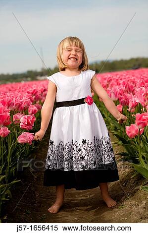 4 year old girl in black and white dress playing and smiling in a tulip fields in Skagit Valley, Washington, USA View Large Photo Image Stock Photography - 4 year old girl in black and white dress playing and smiling in a tulip fields in Skagit Valley, Washington, USA. Fotosearch