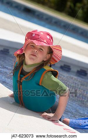 4 year old girl leaning out of the pool on holiday, smiling into camera View Large Photo Image Stock Image - 4 year old girl leaning out of the pool on holiday, smiling into camera. Fotosearch