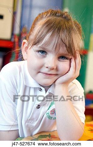 4 year old girl looking into camera at nursery, feeling fedup View Large Photo Image Picture - 4 year old girl looking into camera at nursery, feeling fedup. Fotosearch
