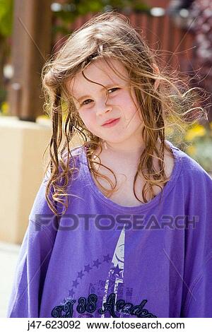 4 year old girl outside, in an oversized t-shirt, three quarter length, looking into camera View Large Photo Image Stock Image - 4 year old girl outside, in an oversized t-shirt, three quarter length, looking into camera. Fotosearch