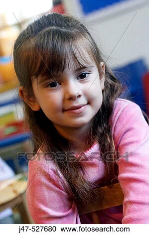 4 year old girl smiling into camera at nursery, View Large Photo Image Stock Image - 4 year old girl smiling into camera at nursery,. Fotosearch