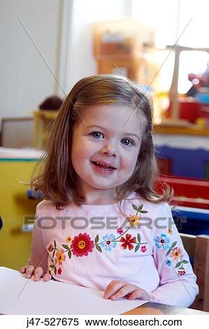 4 year old girl smiling into camera at nursery, View Large Photo Image Stock Photography - 4 year old girl smiling into camera at nursery,. Fotosearch