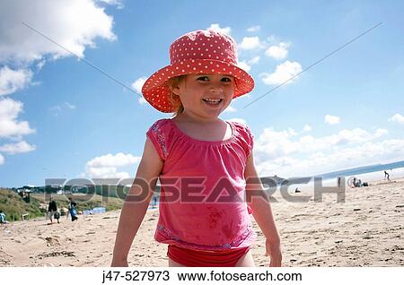 4 year old girl standing on the beach smiling into camera View Large Photo Image Stock Image - 4 year old girl standing on the beach smiling into camera. Fotosearch