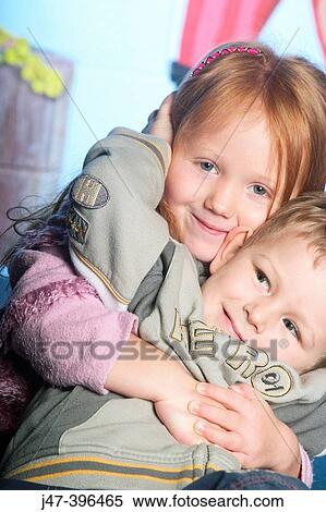 4 year old girl with arms round 3 year old boy, smiling into camera View Large Photo Image Stock Photography - 4 year old girl with arms round 3 year old boy, smiling into camera. Fotosearch