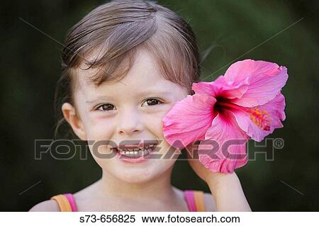 4 year old girl with flower View Large Photo Image Stock Photography - 4 year old girl with flower. Fotosearch