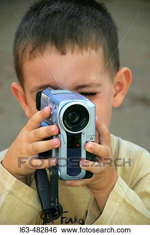 4 years old boy with digital videocamera View Large Photo Image Stock Photograph - 4 years old boy with digital videocamera. Fotosearch