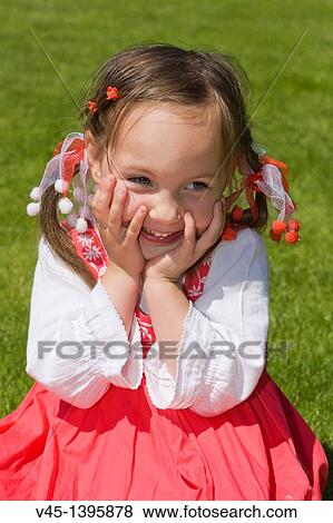 4 years old girl in red dress sitting on the grass. View Large Photo Image Stock Photo - 4 years old girl in red dress sitting on the grass.. Fotosearch