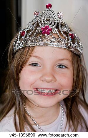Stock Image - 4 years old girl in tiara.. Fotosearch