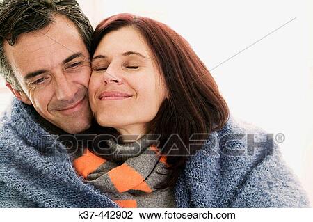 40-45 year old Caucasian couple keeping warm View Large Photo Image Stock Image - 40-45 year old Caucasian couple keeping warm. Fotosearch