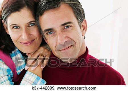 40-45 year old Caucasian couple relaxing in living room View Large Photo Image Stock Photo - 40-45 year old Caucasian couple relaxing in living room. Fotosearch